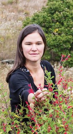 Jessie Dean picks pineapple sage at Rayburn Farm in Barnardsville, North Carolina; farm-to-table tea