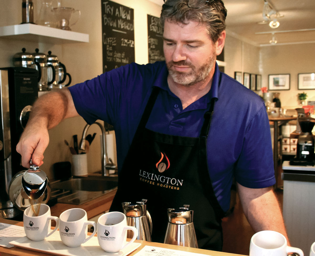 Barista David Tilley pours a flight at Lexington Coffee Roasters' tasting bar. (Photo: courtesy Amira Hegazy.)